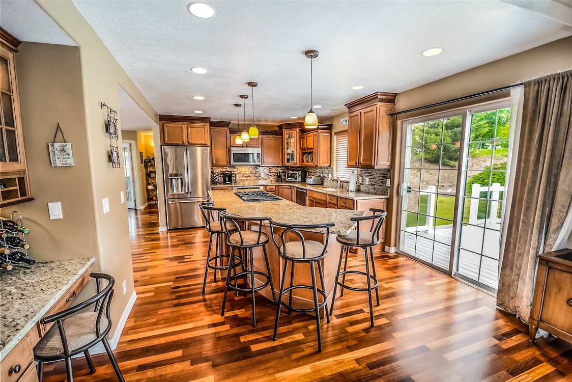 Beautiful, modern suburban home with a manicured lawn under a bright, sunny sky, representing a valuable Northshore proper...